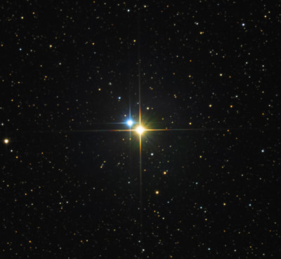 Telescopic image of binary star Albireo.