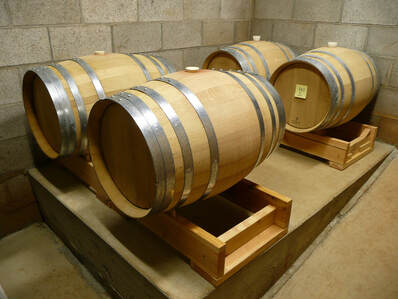 Photo of half-barrels in the cellar.